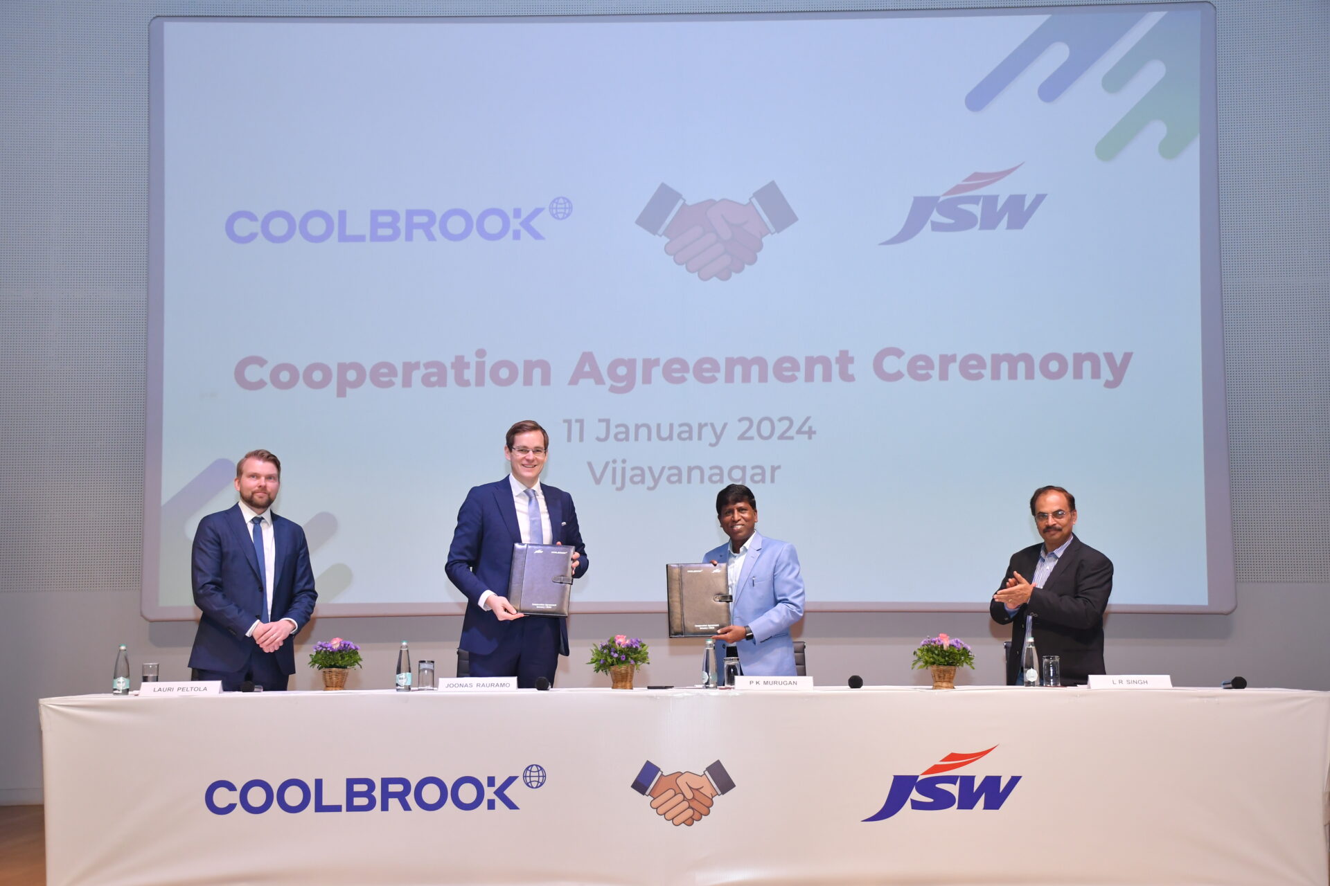 Photo of JSW and Coolbrook executives in cooperation signing ceremony